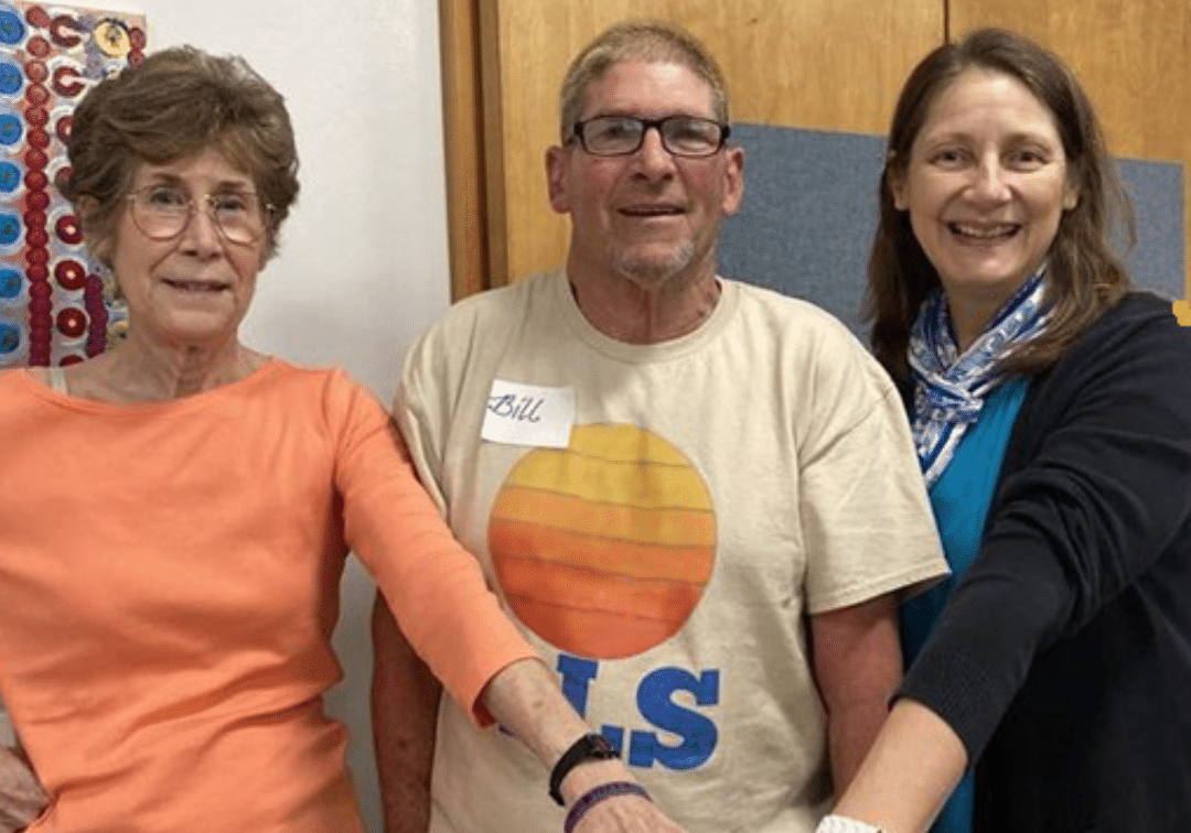 Anne Moffett with BIll Hankins, a person with ALS, and Mary Rebar from ALS Northwest.